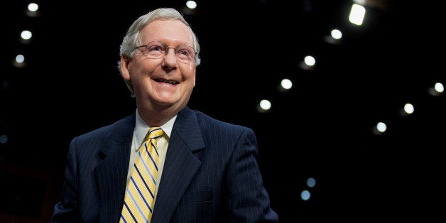 Senate Minority Leader Mitch McConnell of Ky.,smiles on Capitol Hill in Washington, Tuesday, June 3, 2014, following his test