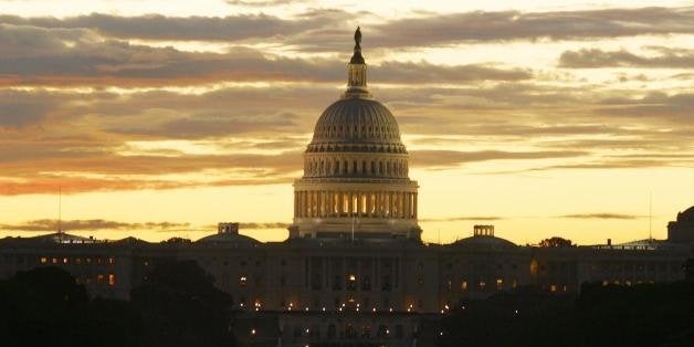 WASHINGTON, : The sun rises over the United States Capitol on the Mall in Washington, DC 10 September 2002. The US Capitol building, an example of 19th-century neoclassical architecture, is among the country's most symbolically important and architecturally impressive buildings. The Capitol houses the meeting chambers of the House of Representatives and the Senate for the past two centuries. AFP PHOTO/Robyn BECK (Photo credit should read ROBYN BECK/AFP/Getty Images)