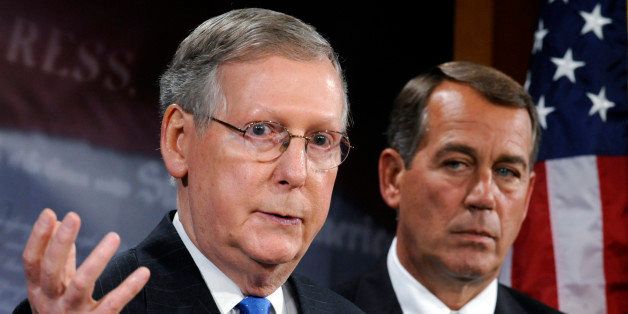 Senate Minority Leader Mitch McConnell of Ky., left, accompanied by House Minority Leader John Boehner of Ohio, gestures during a news conference on Capitol Hill in Washington, Wednesday, Sept. 9, 2009. (AP Photo/Susan Walsh)