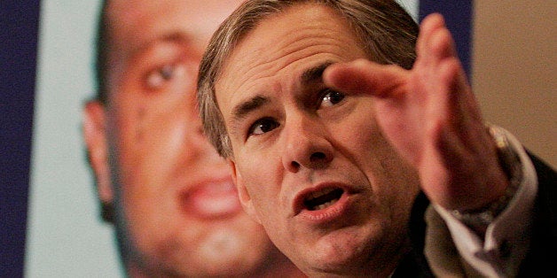 Texas Attorney General Greg Abbott discusses the arrest and search for fugitives at a news conference in Houston, Monday, Dec