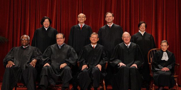 WASHINGTON - OCTOBER 08: U.S. Supreme Court members (first row L-R) Associate Justice Clarence Thomas, Associate Justice Antonin Scalia, Chief Justice John Roberts, Associate Justice Anthony Kennedy, Associate Justice Ruth Bader Ginsburg, (back row L-R) Associate Justice Sonia Sotomayor, Associate Justice Stephen Breyer, Associate Justice Samuel Alito and Associate Justice Elena Kagan pose for photographs in the East Conference Room at the Supreme Court building October 8, 2010 in Washington, DC. This is the first time in history that three women are simultaneously serving on the court. (Photo by Chip Somodevilla/Getty Images)