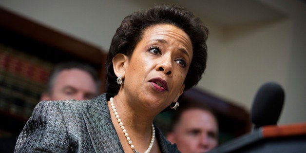 United States Attorney Loretta E. Lynch speaks during a news conference at the U.S. Attorney's office, Monday, June 17, 2013, in the Brooklyn borough of New York. Lynch has announced the indictment of nine individuals involved in a multi-state scheme to conceal the systematic employment of illegal immigrants and steal their identities. (AP Photo/John Minchillo)