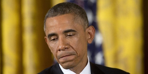 U.S. President Barack Obama pauses while speaking during a news conference in the East Room of the White House in Washington, D.C., U.S., on Wednesday, Nov. 5, 2014. Confronting Republican control of both houses of Congress for the first time during his administration, President Obama faces a dilemma: how to fight when there's political value while at the same time trying to rebuild bridges to lawmakers in the party. Photographer: Andrew Harrer/Bloomberg via Getty Images