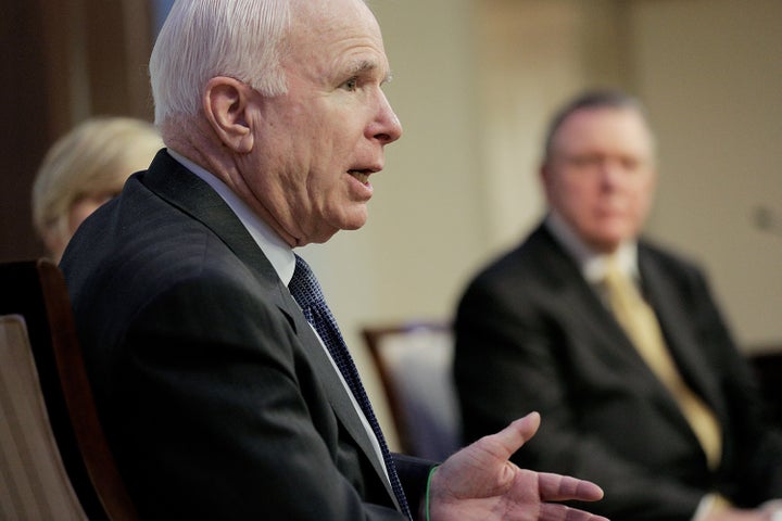 WASHINGTON, DC - JUNE 18: U.S. Sen. John McCain (R-AZ), left, participates in a discussion on the unfolding violence in Iraq with retired Army Gen. Jack Keane and Danielle Pletka of the American Enterprise Institute on June 18, 2014 at the American Enterprise Institute for Public Policy Research in Washington, DC. The rise of the Islamic State in Iraq and Syria (ISIS) over the last year and a decline in the power of the government in Baghdad has led to questions of what America gained from its costly efforts in the region. (Photo by T.J. Kirkpatrick/Getty Images)