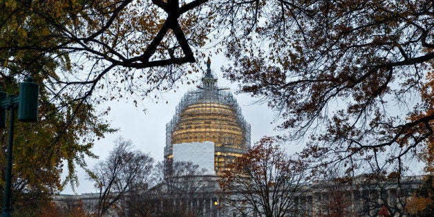 Congress returns for the lame duck session following a sweep for the GOP in the midterm elections that will shift the balance of power on Capitol Hill, giving Republicans control of the Senate, as well as the House, in Washington, Wednesday, Nov. 12, 2014. The Capitol Dome is shrouded in scaffolding for a long-term repair project. (AP Photo/J. Scott Applewhite)