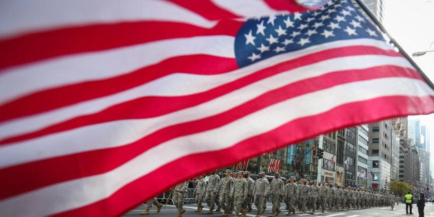 NEW YORK, NY - NOVEMBER 11: Veterans, soldiers, their families and others march in the annual the Veteran's Day Parade along Fifth Avenue on November 11, 2014 in New York City, United States. Often called the largest Veteran's Day Parade in the country, more than 600,000 people are expected to line the streets for the parade which celebrates the scarifies soldiers have made for the country. (Photo by Cem Ozdel/Anadolu Agency/Getty Images)