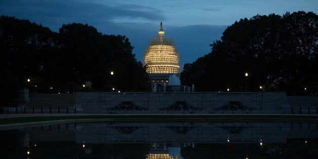 WASHINGTON, DC - NOVEMBER 4: Evening arrives at the Capitol building, covered in scaffolding for major repairs, on Capitol Hill in Washington D.C. Today's elections will decide which party will lead the Senate. (Photo by Allison Shelley/Getty Images)