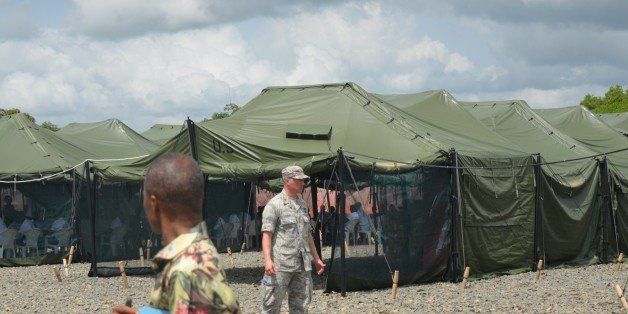 A picture taken on November 10, 2014 in Tubmanburg, the provincial capital of Bomi County in western Liberia shows the new Ebola Treatment Center US built by the United States army. Bomi County has been one of the high-hit region by the deadly virus Ebola. In West Africa, underfunded health systems have been crippled by the disease, which has spiraled out of control and infected more than 13,000 people. AFP PHOTO/ZOOM DOSSO (Photo credit should read ZOOM DOSSO/AFP/Getty Images)