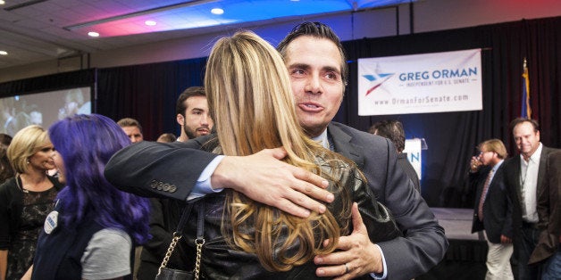 OVERLAND PARK, KS - NOVEMBER 4: Independent candidate, Greg Orman hugs supporters at a watch party on election night at th