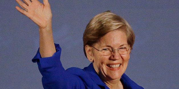 U.S. Sen Elizabeth Warren, D-Mass., waves as she takes the stage to introduce Massachusetts Democratic gubernatorial candidate Martha Coakley during a campaign event at the Park Plaza Hotel Thursday, Oct. 24, 2014 in Boston. (AP Photo/Stephan Savoia)