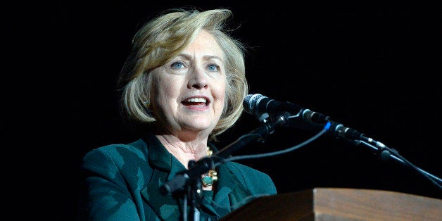 Former Secretary of State Hillary Clinton addresses a group of supporters during a rally for Kentucky democratic senatorial candidate Alison Lundergan Grimes in Highland Heights, Ky., Saturday, Nov. 1, 2014. (AP Photo/Timothy D. Easley)