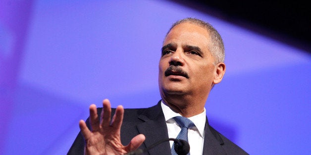WASHINGTON, DC - OCTOBER 25: U.S. Attorney General Eric Holder speaks at the 18th Annual HRC National Dinner at The Walter