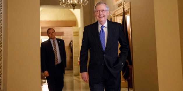 Assured of becoming the next Senate majority leader after the sweep for the GOP in the midterm elections, current Senate Minority Leader Mitch McConnell of Ky. smiles as he arrives for a meeting of Senate Republicans to choose their leaders for the Congress that convenes in January, Thursday, Nov. 13, 2014, on Capitol Hill in Washington. (AP Photo/J. Scott Applewhite)