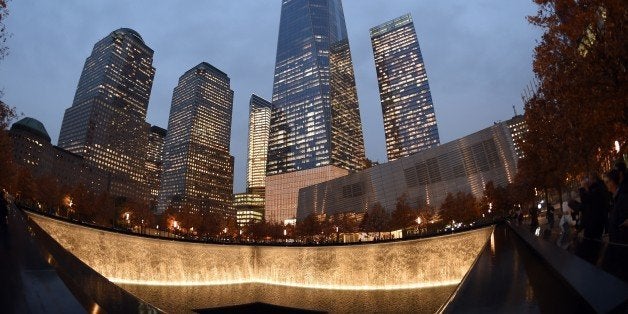 One World Trade Center raises high above a reflecting pool November 13, 2014 in New York. Patrick Foye, Executive Director of the Port Authority of New York and New Jersey, says that new tenants continue to sign contracts to lease space in the building. AFP PHOTO/Don Emmert (Photo credit should read DON EMMERT/AFP/Getty Images)