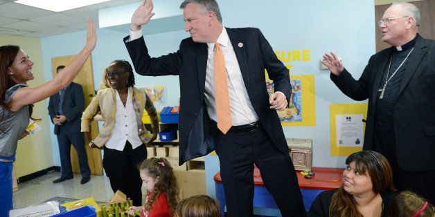 NEW YORK, NY - SEPTEMBER 4: New York Mayor Bill de Blasio visits a Pre-K class on September 4, 2014 at Sacred Heart School in the Staten Island borough of New York City. New York Mayor Bill de Blasio is touring universal pre-kindergarten programs throughout the city. Also pictured (L-R) is teacher Corie Caccese, First Lady Chirlane McCray, New York Mayor Bill de Blasio and Timothy Cardinal Dolan. (Photo by Susan Watts-Pool/Getty Images)