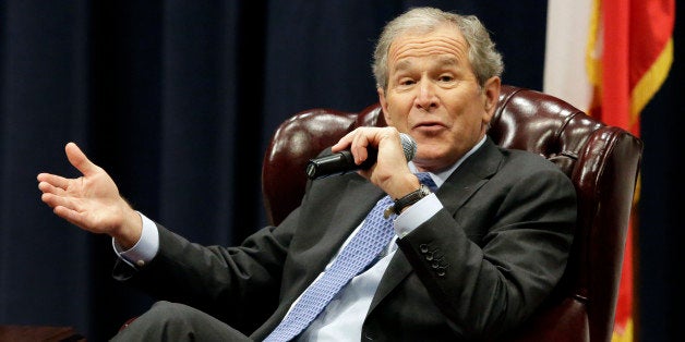 Former President George W. Bush discusses his new book "41: A Portrait of My Father" at his father's George H.W. Bush Presidential Library, Tuesday, Nov. 11, 2014, in College Station, Texas. (AP Photo/Pat Sullivan)