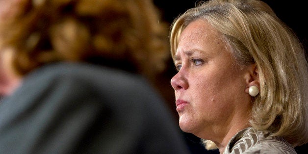 Senator Mary Landrieu, a Democrat from Louisiana, right, listens during a news conference at the U.S. Capitol in Washington,
