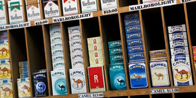 In this March 18, 2013 file photo cigarette packs are displayed for sale at a convenience store in New York. No one under 21 would be able to buy cigarettes in New York City under a proposal unveiled Monday, April 22, 2013 to make the city the most populous place in America to set the minimum age that high. (AP Photo/Mark Lennihan, file)