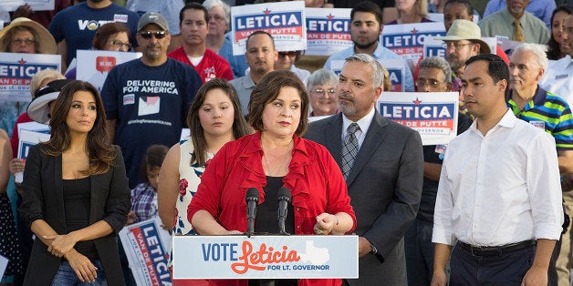 SAN ANTONIO, TX - OCTOBER 22: State Senator Leticia van de Putte, candidate for Lieutenant Governor of Texas speaks as (L-R) Eva Longoria, actor, director, producer and activist, student Tiana Trejo, Henry R. Munoz, III, Latino activist and advocate, and Congressman Joaquin Castro attend the bus tour kickoff to support Leticia van de Putte for Lieutenant Governor on October 22, 2014 in San Antonio, Texas. (Photo by Rick Kern/Getty Images for Latino Victory Project)