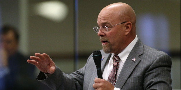 Nevada Assemblyman Ira Hansen, R-Sparks, speaks on the Assembly floor during the second day of a special session at the Nevada Legislature, Thursday, Sept. 11, 2014, in Carson City, Nev. Lawmakers are considering an unprecedented package of up to $1.3 billion in incentives to bring Tesla Motors' $5 billion battery factory to the state. (AP Photo/Cathleen Allison)