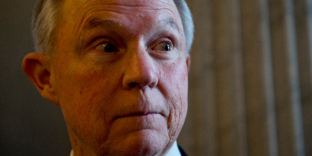 UNITED STATES - JANUARY 28: Sen. Jeff Sessions, R-Ala., talk with a reporter before the senate luncheons on the day President
