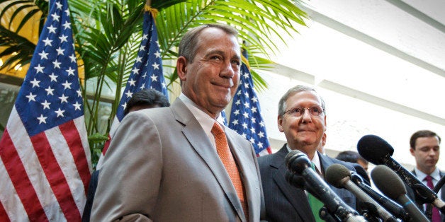 Senate Minority Leader Mitch McConnell of Ky. listens at right as House Speaker John Boehner of Ohio speaks during a news con