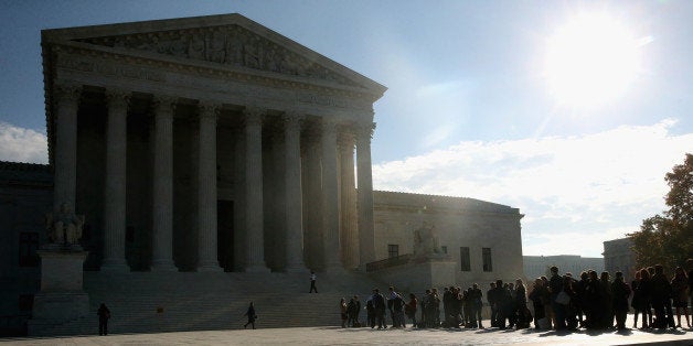 WASHINGTON, DC - NOVEMBER 12: People stand in line to enter the US Supreme Court building, November 12, 2014 in Washington, DC. Today the high court will hear oral arguments for cases, Alabama Legislative Black Caucus v. Alabama, Alabama Democratic Conference v. Alabama, and Comptroller of Treasury of Maryland v. Wynne. (Photo by Mark Wilson/Getty Images)