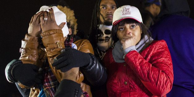 FERGUSON, MO - NOVEMBER 24: Lesley McSpadden (L), mother of Michael Brown, reacts to the decision by the Grand Jury not to indict Officer Daren Wilson in the shooting death of her son, in Ferguson, Missouri on November 24, 2014. (Photo by Samuel Corum/Anadolu Agency/Getty Images)