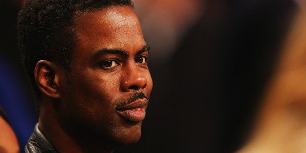 NEW YORK, NY - NOVEMBER 01: Comedian Chris Rock looks on during the game between the Miami Heat and the Brooklyn Nets at the Barclays Center on November 1, 2013 in the Brooklyn borough of New York City. NOTE TO USER: User expressly acknowledges and agrees that, by downloading and or using this photograph, User is consenting to the terms and conditions of the Getty Images License Agreement. (Photo by Al Bello/Getty Images) 