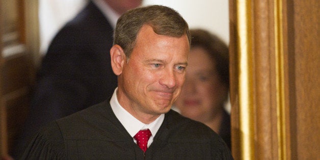 US Supreme Court Chief Justice John Roberts is followed by Elena Kagan on her way to take the Judicial Oath to become the 112