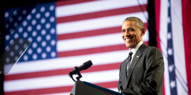 President Barack Obama smiles while speaking at the Copernicus Community Center in Chicago to discuss immigration reform, Tue