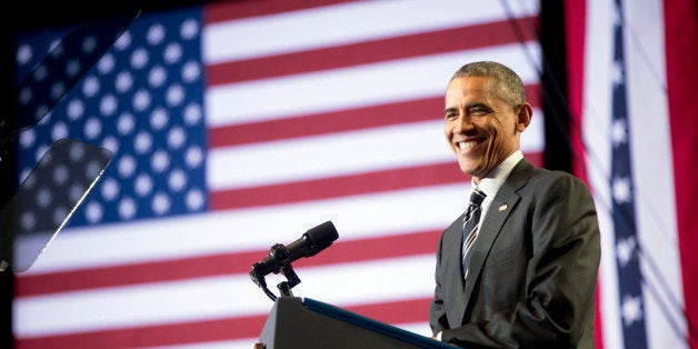 President Barack Obama smiles while speaking at the Copernicus Community Center in Chicago to discuss immigration reform, Tuesday, Nov. 25, 2014. Obama visited his hometown to promote his executive action on immigration. (AP Photo/Pablo Martinez Monsivais)