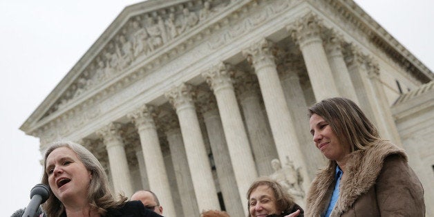 WASHINGTON, DC - DECEMBER 03: Peggy Young (R), the plaintiff in Young vs UPS, and her attorney Sharon Fast Gustafson (L), answer questions outside the U.S. Supreme Court after the court heard arguments in her case December 3, 2014 in Washington, DC. The case involves, Young, a former UPS driver who requested temporary assignment to avoid lifting heavy packages after she became pregnant. (Photo by Win McNamee/Getty Images)