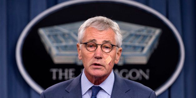 Defense Secretary Chuck Hagel speaks during a news conference at the Pentagon, Friday, Nov. 14, 2014, where he announced that he is ordering top-to-bottom changes in how the nation's nuclear arsenal is managed, vowing to invest billions of dollars more to fix what ails a force beset by leadership lapses, security flaws and sagging morale. (AP Photo/Evan Vucci)