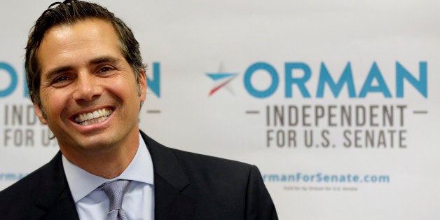 FILE - In this July 10, 2014 file photo Kansas Independent U.S. Senate candidate Greg Orman talks about launching his television and radio ad campaign in Shawnee, Kan. Orman, who started a lighting company from scratch in 1992 that made his first $1 million, is now at the center of one of the nationâs most unusual and pivotal U.S. Senate races as Republicans try to wrest control of the chamber away from Democrats. (AP Photo/Charlie Riedel, File)