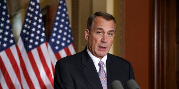 House Speaker John Boehner of Ohio responds to President Barack Obama's intention to spare millions of illegal immigrants from being deported, a use of executive powers that is setting up a fight with Republicans in Congress over the limits of presidential powers, Friday, Nov. 21, 2014, during a news conference on Capitol Hill in Washington. Boehner, who has refused to have his members vote on broad immigration legislation passed by the Senate last year, said earlier that Obama's decision to go it alone "cemented his legacy of lawlessness and squandered what little credibility he had left." (AP Photo/J. Scott Applewhite)