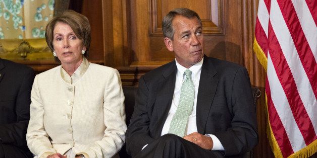 In this photo taken July 11, 2012, House Speaker John Boehner of Ohio, right, and House Minority Leader Nancy Pelosi of Calif., left, sit together on Capitol Hill in Washington. Uniforms for U.S. Olympic athletes are American red, white and blue _ but made in China. That has members of Congress fuming. Republicans and Democrats railed Thursday about the U.S. Olympic Committee's decision to dress the U.S. team in Chinese manufactured berets, blazers and pants while the American textile industry struggles economically with many U.S. workers desperate for jobs. (AP Photo/J. Scott Applewhite)