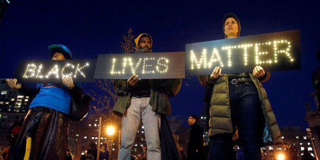 Protesters rallying against a grand jury's decision not to indict the police officer involved in the death of Eric Garner gather in Foley Square, Thursday, Dec. 4, 2014, in New York. (AP Photo/Jason DeCrow)