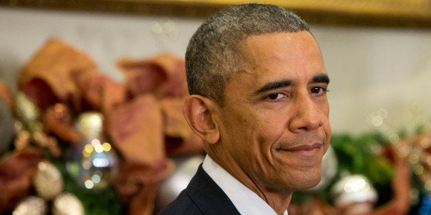 In this Friday, Dec. 5, 2014 photo, President Barack Obama listens in the Roosevelt Room of the White House in Washington as Ashton Carter speaks during the announcement of Carter for defense secretary. The White House says President Barack Obama is getting some medical tests at a military hospital just outside Washington after complaining of a sore throat. (AP Photo/Jacquelyn Martin)