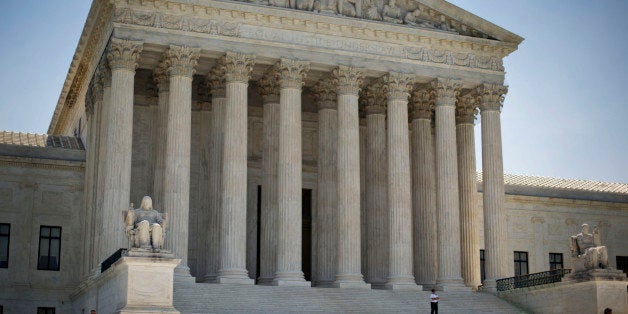 The Supreme Court building in Washington, Monday, June 30, 2014, following various court decisions. The court ruled on birth control, union fees and other cases. (AP Photo/Pablo Martinez Monsivais)