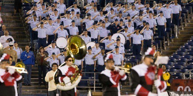 SAN DIEGO, CA - NOVEMBER 21: Members of the Air Force marching band salute during the national anthem during the college football game against San Diego State at Qualcomm Stadium on November 21, 2014 in San Diego, California. (Photo by Mpu Dinani/Getty Images)
