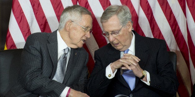 UNITED STATES - SEPTEMBER 10: Senate Majority Leader Harry Reid, D-Nev., left, speaks with Senate Minority Leader Mitch McConnell, R-Ky., during the Gold Medal ceremony honoring the fallen heroes of 9/11 in the Capitol Visitor Center on Wednesday, Sept. 10, 2014. Medals presented to the Flight 93 National Memorial in Pennsylvania, the National September 11 Memorial and Museum in New York, and the Pentagon Memorial. (Photo By Bill Clark/CQ Roll Call)