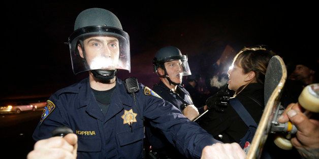 California Highway Patrol officers push back protesters who blocked Highway 80 in response to police killings in Missouri and New York in Berkeley, Calif., Monday, Dec. 8, 2014. (AP Photo/Jeff Chiu)