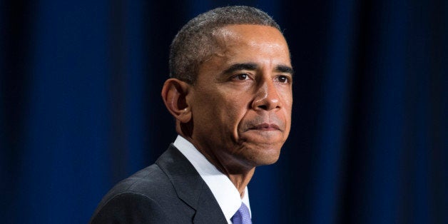 President Barack Obama pauses as he speaks about the Senior Executive Service, composed of the senior leadership of the Federal workforce, Tuesday, Dec. 9, 2014, in Washington. Obama is launching a leadership program for future government career executives with a goal of giving potential managers multi-agency experiences and breaking out of a tradition of promoting senior bureaucrats from within their own agencies. (AP Photo/Evan Vucci)