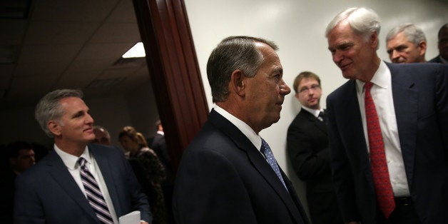 WASHINGTON, DC - DECEMBER 02: U.S. Speaker of the House John Boehner (C) (R-OH) leaves the weekly Republican conference meeting at the U.S. Capitol December 2, 2014 in Washington, DC. Boehner and members of the House Republican leadership met with reporters following their weekly conference meeting. Also pictured are Rep. Kevin McCarthy (L) (R-CA) and Rep. Ander Crenshaw (R) (R-FL). (Photo by Win McNamee/Getty Images)