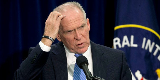 CIA Director John Brennan gestures during a news conference at CIA headquarters in Langley, Va., Thursday, Dec. 11, 2014. Brennan defending his agency from accusations in a Senate report that it used inhumane interrogation techniques against terrorist suspect with no security benefits to the nation. (AP Photo/Pablo Martinez Monsivais)