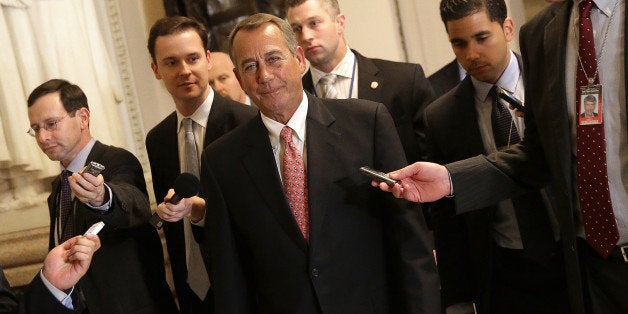 WASHINGTON, DC - DECEMBER 11: House Speaker John Boehner (C) (R-OH) walks to the House chamber for an expected vote on a $1.1 trillion government funding bill on December 11, 2014 in Washington, DC. Congress is attempting to pass a last minute funding bill for the federal government to avoid a government shutdown at midnight tonight. (Photo by Win McNamee/Getty Images)