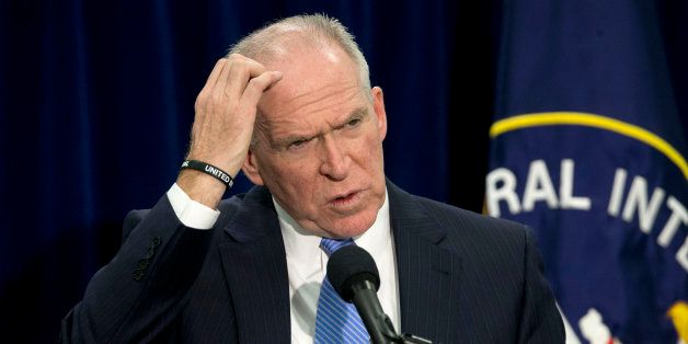 CIA Director John Brennan gestures during a news conference at CIA headquarters in Langley, Va., Thursday, Dec. 11, 2014. Brennan defending his agency from accusations in a Senate report that it used inhumane interrogation techniques against terrorist suspect with no security benefits to the nation. (AP Photo/Pablo Martinez Monsivais)
