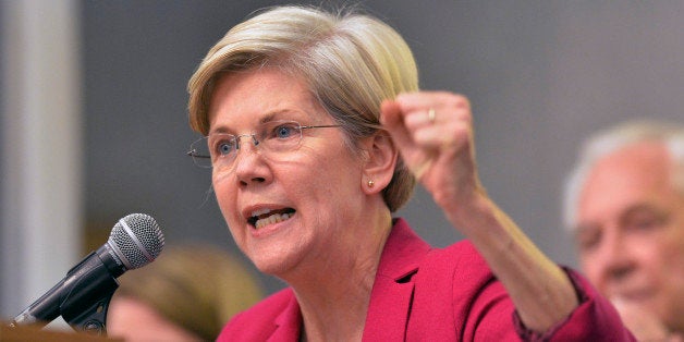 Massachusetts Senator Elizabeth Warren speaks to supporters during a rally for Kentucky senatorial candidate Alison Lundergan Grimes at the International Brotherhood of Electrical Workers Local Union 369 meeting hall in Louisville, Ky., Tuesday, Oct. 28, 2014. (AP Photo/Timothy D. Easley)