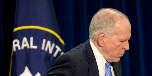 Central Intelligence Director (CIA) Director John Brennan walks away following the conclusion of his news conference at CIA H